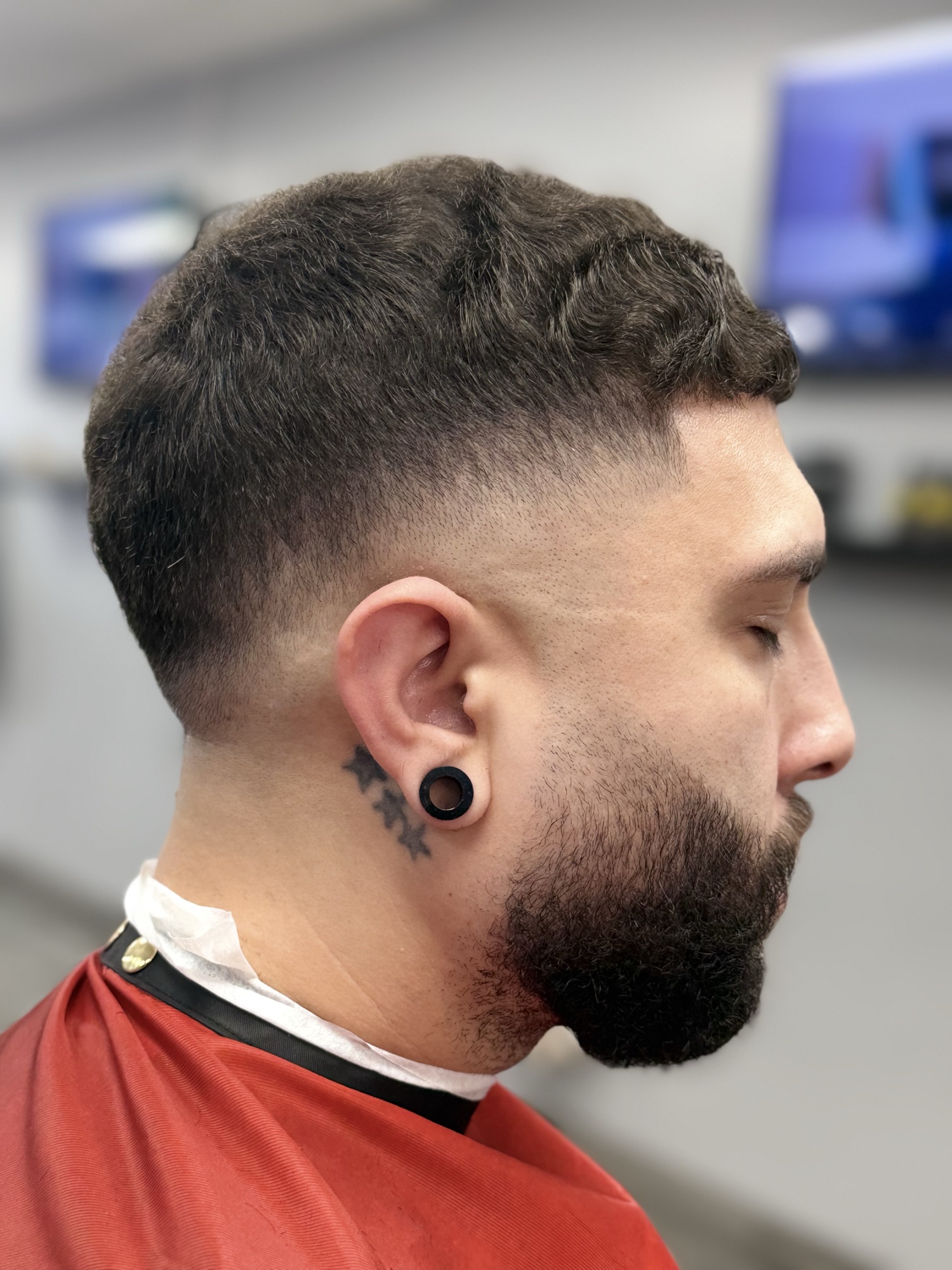 Mid fade with sculpted beard at X Express Barbershop